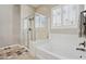 Spa-like bathroom with soaking tub, walk-in shower, and upgraded fixtures at 10062 W Redbird Rd, Peoria, AZ 85383