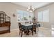 Charming dining area with wood table and chairs at 10062 W Redbird Rd, Peoria, AZ 85383