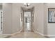 Elegant entryway with tile flooring and artwork at 10062 W Redbird Rd, Peoria, AZ 85383