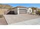 House exterior with driveway and gate at 10062 W Redbird Rd, Peoria, AZ 85383