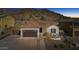 Stunning aerial view of the home, with mountain views, tile roof, and well-manicured front yard at 10062 W Redbird Rd, Peoria, AZ 85383