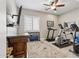Well-equipped home gym featuring treadmill, elliptical, and weights at 10062 W Redbird Rd, Peoria, AZ 85383