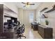 Bright home office features built-in desk and shelving, providing ample workspace at 10062 W Redbird Rd, Peoria, AZ 85383