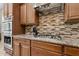 Spacious kitchen with granite countertops, stainless steel appliances, and custom cabinetry at 10062 W Redbird Rd, Peoria, AZ 85383