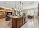 Island kitchen with granite countertop and seating at 10062 W Redbird Rd, Peoria, AZ 85383