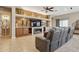 Living room with fireplace and entertainment center at 10062 W Redbird Rd, Peoria, AZ 85383