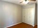 Bedroom with wood flooring and built-in closet at 10138 W Highland Ave, Phoenix, AZ 85037