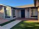 Front entrance of the home with a walkway and landscaping at 10138 W Highland Ave, Phoenix, AZ 85037