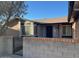 Brick home with a gated entrance and well-maintained landscaping at 10138 W Highland Ave, Phoenix, AZ 85037