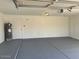 Garage with painted floor and extra storage space at 10138 W Highland Ave, Phoenix, AZ 85037