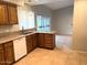 Bright kitchen featuring granite countertops and wood cabinets at 10138 W Highland Ave, Phoenix, AZ 85037