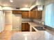 Kitchen with granite countertops and wood cabinets at 10138 W Highland Ave, Phoenix, AZ 85037