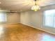 Bright and airy living room with tile floors and ceiling fan at 10138 W Highland Ave, Phoenix, AZ 85037