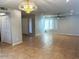 Spacious living room with tile floors and neutral walls at 10138 W Highland Ave, Phoenix, AZ 85037