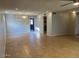 Open concept living room with tile floors and access to kitchen at 10138 W Highland Ave, Phoenix, AZ 85037