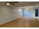 Living room with tile floors, neutral walls, and ceiling fan at 10138 W Highland Ave, Phoenix, AZ 85037