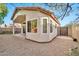 Landscaped backyard with gravel, covered patio and gate at 10634 W Mohawk Ln, Peoria, AZ 85382