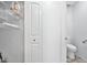 Simple bathroom with toilet and shelving at 10634 W Mohawk Ln, Peoria, AZ 85382