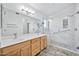 Bathroom boasts double sinks, a large walk-in shower, and modern fixtures at 10634 W Mohawk Ln, Peoria, AZ 85382