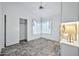 Well-lit bedroom featuring tile floors, a window seat, and a ceiling fan at 10634 W Mohawk Ln, Peoria, AZ 85382