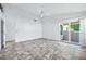 Spacious bedroom with tile floors and sliding door to patio at 10634 W Mohawk Ln, Peoria, AZ 85382