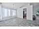 Dining room with tile floors and access to kitchen and backyard at 10634 W Mohawk Ln, Peoria, AZ 85382