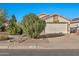 House exterior featuring a two-car garage and well-maintained landscaping at 10634 W Mohawk Ln, Peoria, AZ 85382