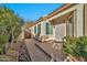 Front entry with walkway, gate, and well-maintained landscaping at 10634 W Mohawk Ln, Peoria, AZ 85382