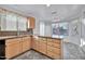 Kitchen features light wood cabinets, granite countertops, and a breakfast nook at 10634 W Mohawk Ln, Peoria, AZ 85382