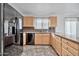 Modern kitchen with black appliances and ample cabinet space at 10634 W Mohawk Ln, Peoria, AZ 85382