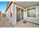 Covered patio with sliding glass door and exterior access at 10634 W Mohawk Ln, Peoria, AZ 85382