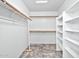 Large walk-in closet with shelving and hanging rods at 10634 W Mohawk Ln, Peoria, AZ 85382