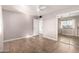 Bright bedroom with tiled floors and mirrored closet doors at 11068 W Florida Ave, Sun City, AZ 85351