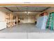 Attached garage with shelving, storage, and ample space at 11589 N 110Th Pl, Scottsdale, AZ 85259