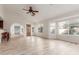 Living room with wood-look floors, access to the kitchen and backyard at 11589 N 110Th Pl, Scottsdale, AZ 85259