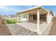 Covered patio, artificial turf, and brick pavers at 11667 W Marguerite Ave, Avondale, AZ 85323