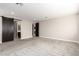 Spacious bedroom with carpeted flooring and barn door at 11667 W Marguerite Ave, Avondale, AZ 85323