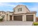 Two-story home with Spanish-style architecture and a three-car garage at 11667 W Marguerite Ave, Avondale, AZ 85323