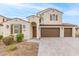 Two-story home with Spanish-style architecture and a three-car garage at 11667 W Marguerite Ave, Avondale, AZ 85323