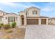Two-story house with a two-car garage and landscaping at 11667 W Marguerite Ave, Avondale, AZ 85323
