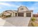 Two-story house with a two-car garage and landscaping at 11667 W Marguerite Ave, Avondale, AZ 85323