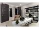 Home office with built-in shelving, a desk, and comfortable seating at 11667 W Marguerite Ave, Avondale, AZ 85323