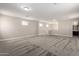 Spacious loft area with carpet flooring and access to bathroom at 11667 W Marguerite Ave, Avondale, AZ 85323