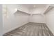 Spacious walk-in closet with ample shelving and hanging rods at 11667 W Marguerite Ave, Avondale, AZ 85323