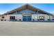 Community building with attractive blue entry doors and landscaping at 120 N Val Vista Dr # 186, Mesa, AZ 85213