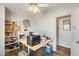 Bright home office features built-in shelving and a large desk at 120 N Val Vista Dr # 186, Mesa, AZ 85213