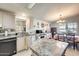 Kitchen with island, stainless steel appliances, and dining area at 120 N Val Vista Dr # 186, Mesa, AZ 85213
