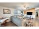 Spacious living room featuring hardwood floors and a wood accent wall at 120 N Val Vista Dr # 186, Mesa, AZ 85213