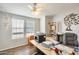 Home office with large desk, printer, and gray chair at 120 N Val Vista Dr # 186, Mesa, AZ 85213