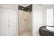 Beautiful bathroom featuring a frameless glass shower and luxurious soaking tub at 12079 E Cortez Dr, Scottsdale, AZ 85259